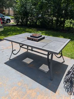 Patio table with fire pit attached