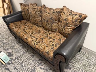 Gorgeous faux leather and hand carved wood couch