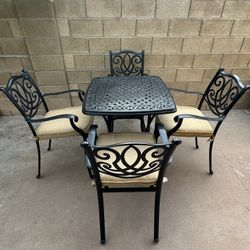 Patio Set. Table and Chairs. With Cushions. Very Nice Condition.