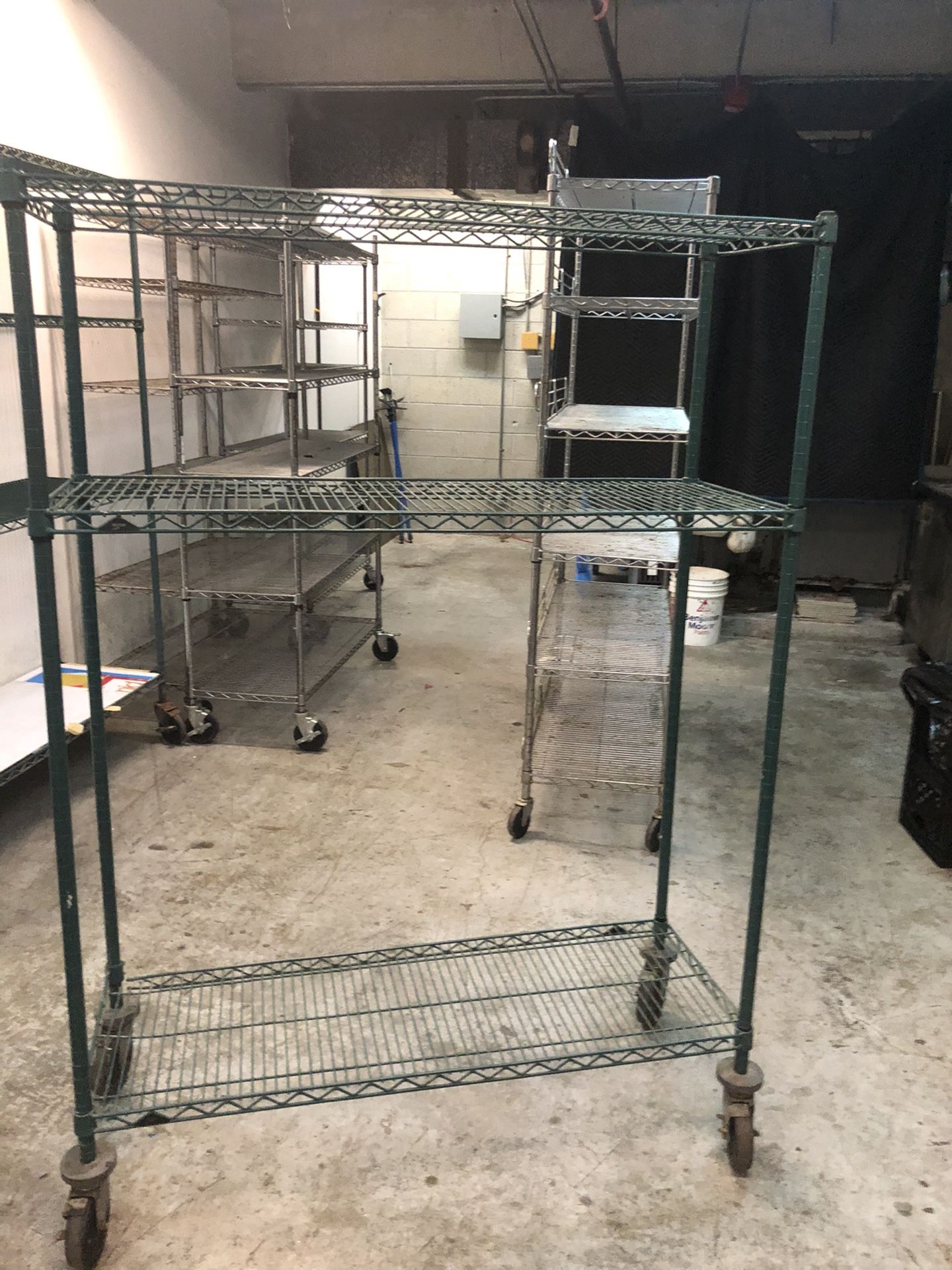 Shelves Green metal shelving with wheels, 48”Wx18x68”H 2 available