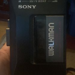 Sony Walkman And Sony MDR-V100 Headphones 
