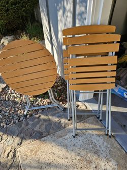 Folding bistro table and two folding chairs