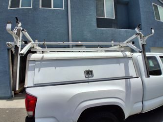 Camper shell, ladder rack, pest control rig