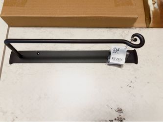 Wrought-iron towel holder. Toilet roll holder.
