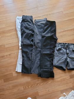 4 Pairs Of Pants And 1 Pair Of Shorts