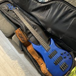Bass Guitar And Amp With Accesories