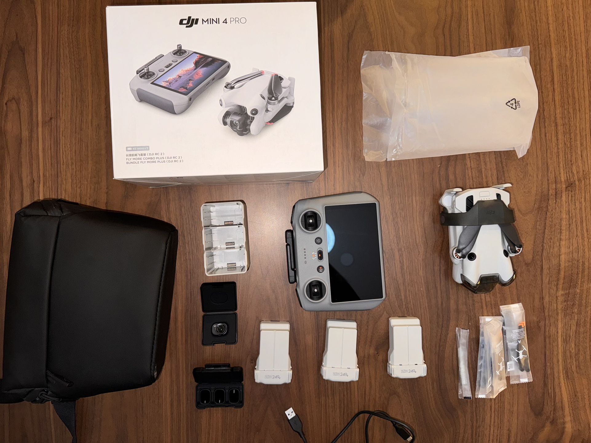 DJI - Mini 4 Pro Fly More Combo Drone and RC 2 Remote Control with Built-in Screen