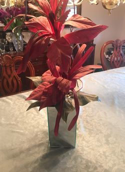 Silk flower in mirror pot