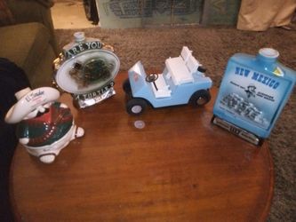 FOUR EMPTY COLLECTIBLE CERAMIC DECANTERS
