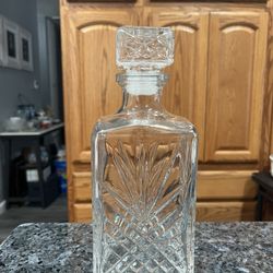  Decanter Clear Glass Square Starburst Design .  Size approximately 9 inches tall.  Preowned.  Has been on display in a cabinet.  Smoke free ho