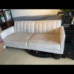 76” Futon couch folds open to twin size bed