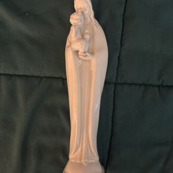 Vintage Goebel Hummel Madonna figurine featuring the Virgin Mary and Jesus in white porcelain. This 10 1/2-inch tall figurine, manufactured in the 50s