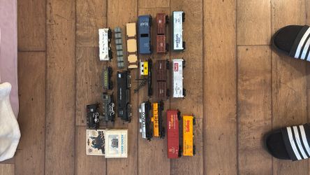Assorted HO Scale Locomotives And Rolling Stock