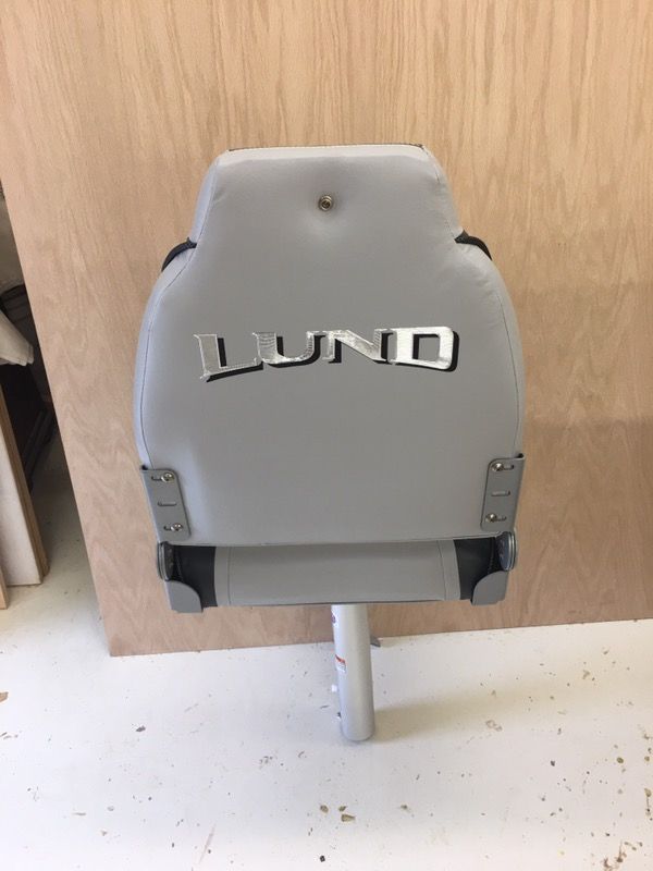 New Lund boat seat with pedestal post and seat mount . Firm on price !