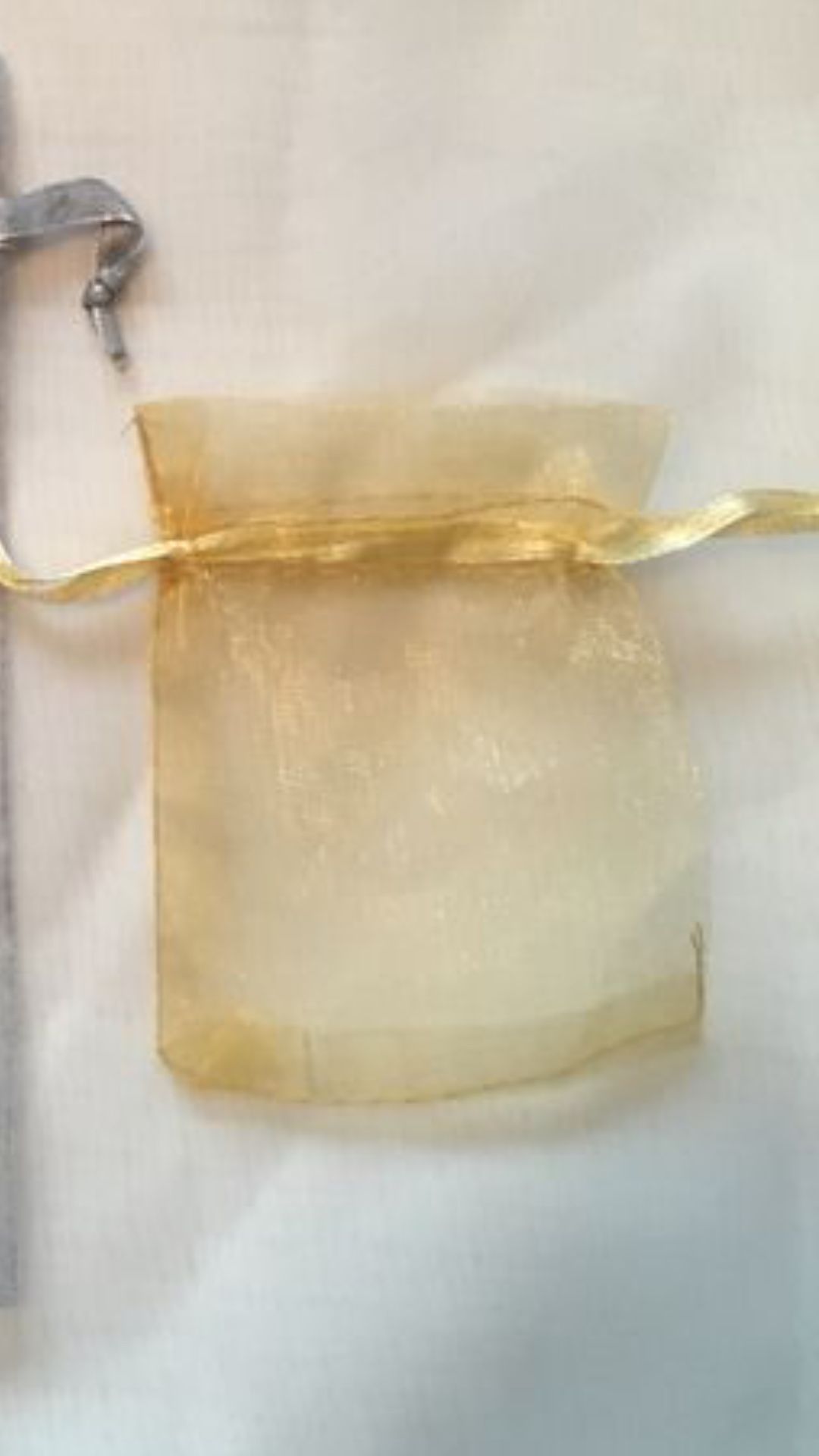 Organza bags gold 34 (4in. Tall x 3in. Wide)....Brand new never used.