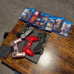 PlayStation 4 Slim with 3 Wireless Controllers and Games.