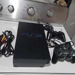 Play Station 2. it turns on, but doesn't read the disks.   2 controllers  and one game.
