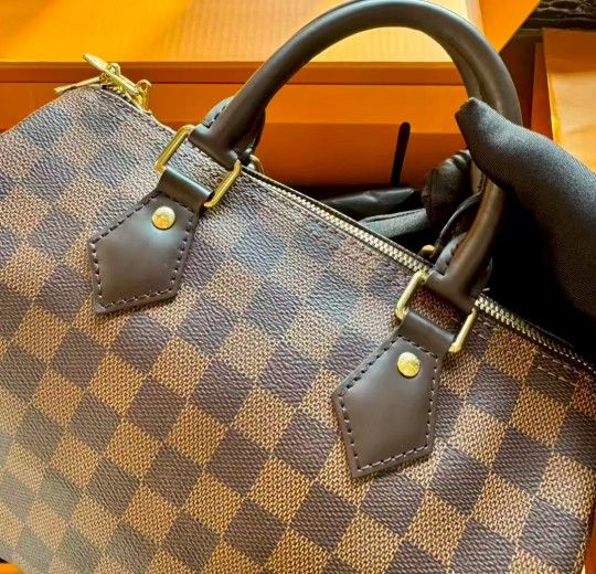 Louis Vuitton speedy brown checkered shoulder bag with crossbody strap