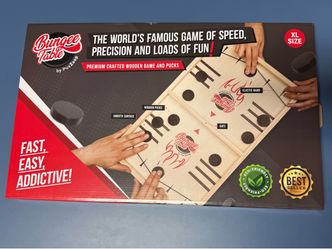 The PuxZoop Bungee Table Board Game is a speed-themed game that is both fun and competitive. Made with eco-friendly materials, it features XL size woo