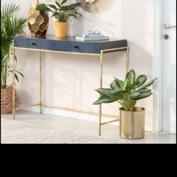 Navy blue gold entryway table.