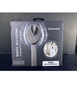 Black Wolf Sonic Scrubber Pro, a rechargeable vibrating brush featuring charcoal-infused silicone bristles.The device includes a telescoping handle de