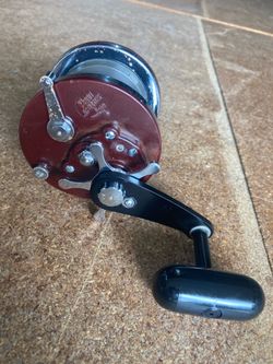Narrow Penn Jigmaster fishing reel