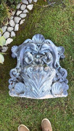 Garden wall statue