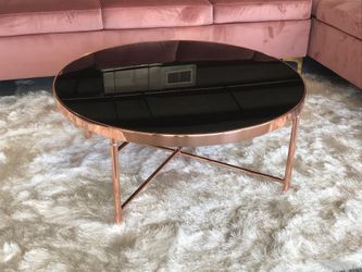 rose gold coffee table with black glass on top