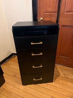 Black vanity with matching storage chair