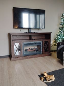 TV combo with electric fireplace place. Must move fast. $25.00 for both or better