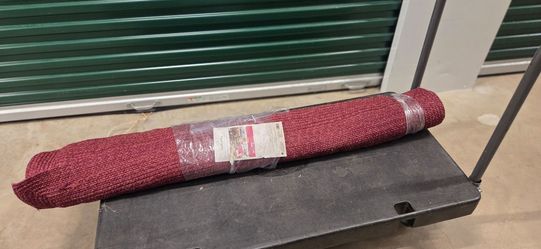 Red Outdoor Area Rug, Rolled New in Wrap