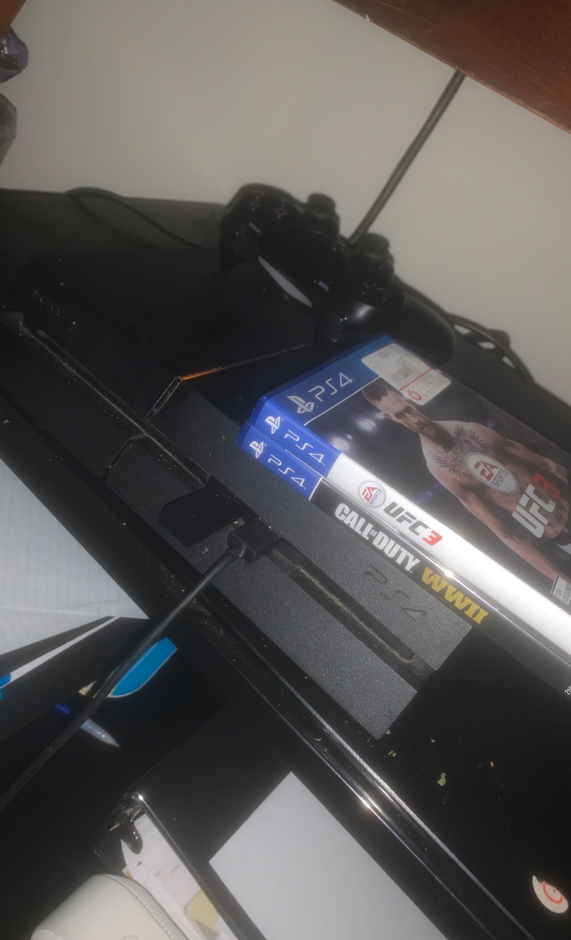 PS4 with headphones and 4 games