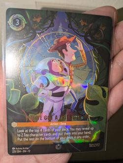 Lorcana enchanted card buzz and Woody