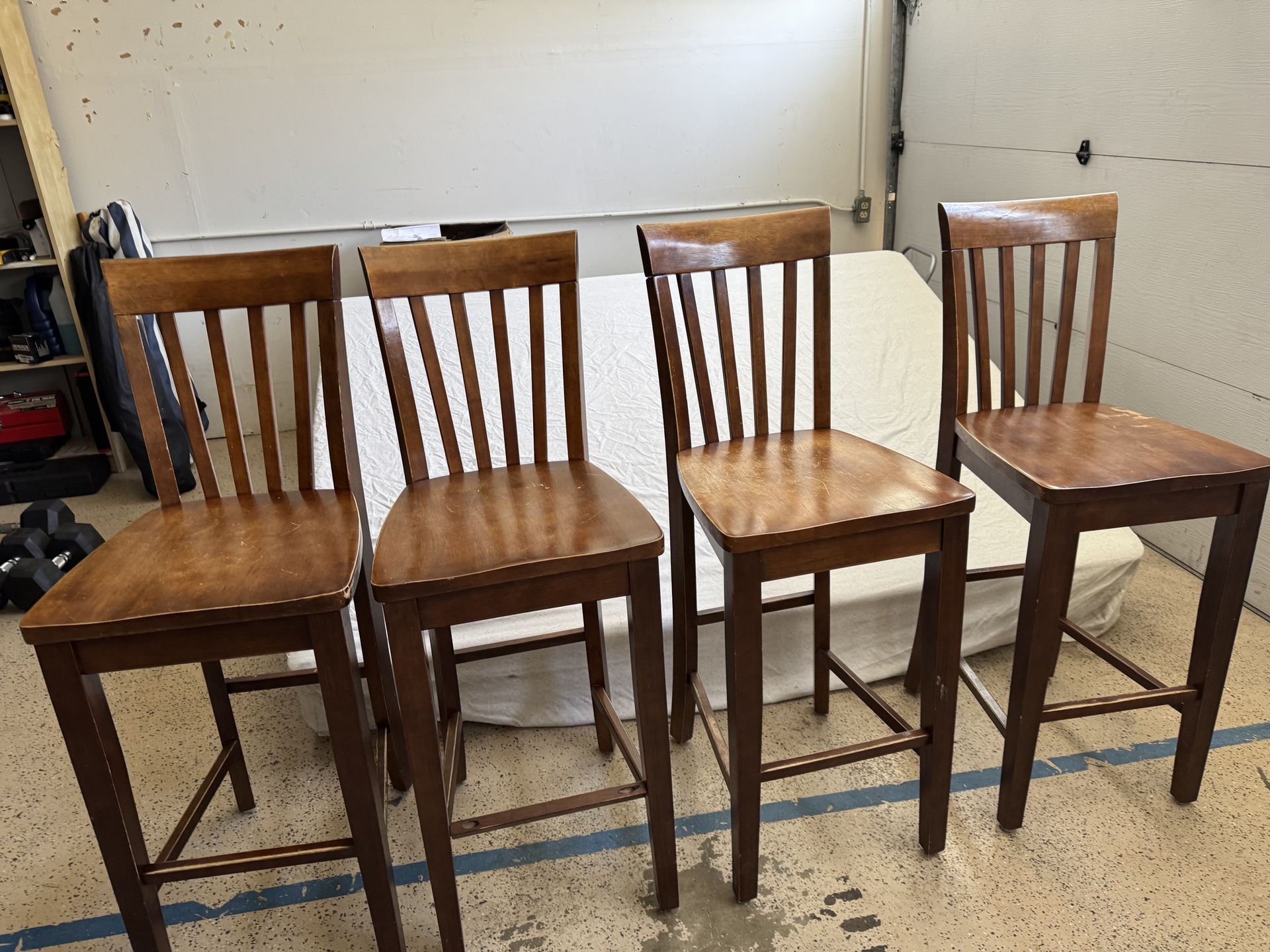 Four Brown Wooden Tall Chairs