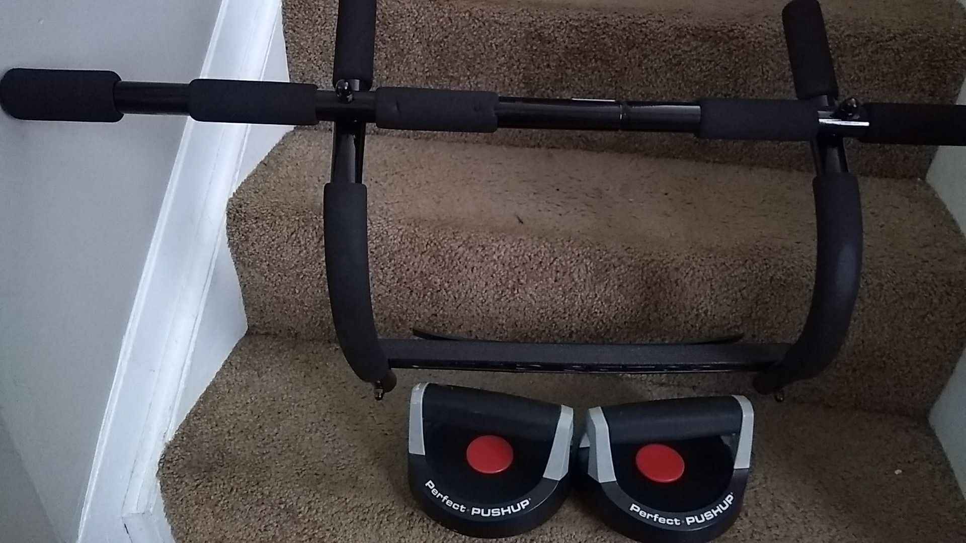 Exercise equipment. Bar for door Also push up weights.