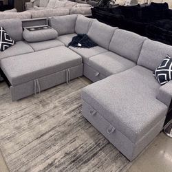Beautiful Sectional With Pull Out Bed ,storage And Cup Holder 