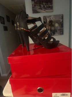 Black leather Guess high heel sandals, size 7M