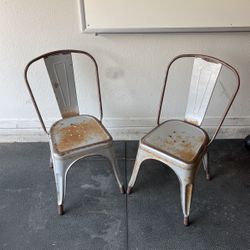 A Pair Of Industrial Metal Chairs
