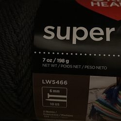 Red heart yarn. 3 white, 3 light gray, heather, 3 charcoal, 2 black