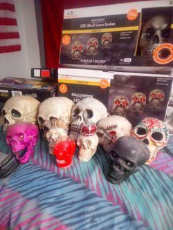 Halloween or mancave skull and ghost lawn stakes and 10 loose variety skulls