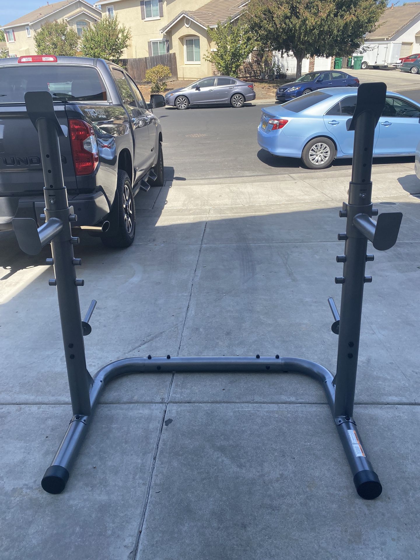 NEW NEVER USED . Olympic Squat Rack With adjustable Heights 