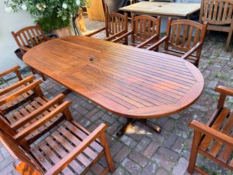 Royal Teak Brand Oval Teak Table with 8 Matching Teak Chairs all with Armrests   Located in concord Recently cleaned, sanded and teak oiled Teak wood 