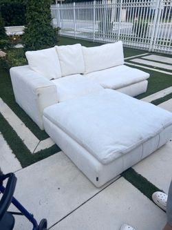 Modern white sofa. Super comfortable. Needs a quick clean.