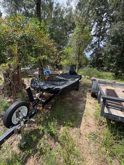 14 ft John boat , with boat trailer , and 6.5 four stroke outboard