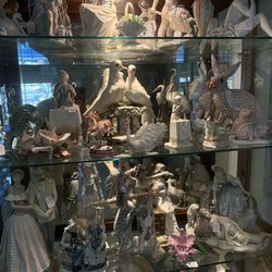 A Large  Collection of Porcelin Figuerins And Crystals