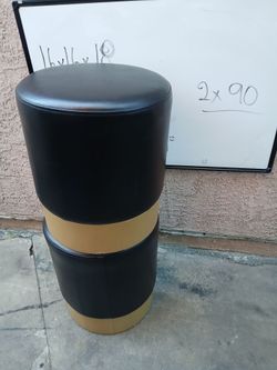 Round Black Faux Leather Ottoman with Gold Band