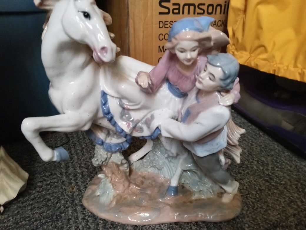 Porcelain statue and painted.