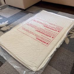 New mini crib mattress
