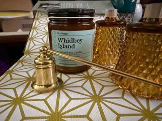 Vintage Brass Candle Snuffer   Polished brass candle snuffer with a long handle and a bell-shaped extinguisher with a pivoting head for easy use.