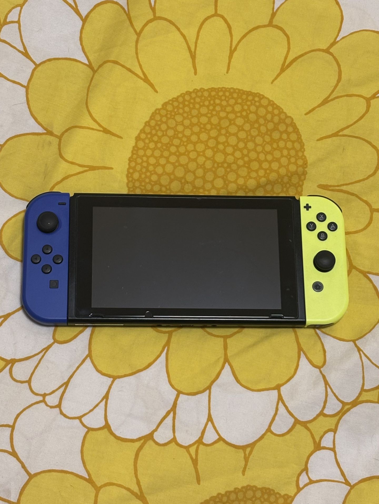 Nintendo Switch (Includes 128GB SD Card, Extra Joy-Cons, Dock, 4 Games, and More)